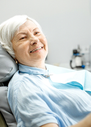 Older woman smiling, waiting for advanced dental implant procedures in Carmichael, CA