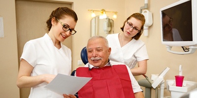 Patient and dental team discussing candidacy for All-on-4