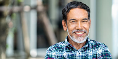 Bearded man smiling after bone grafting in Carmichael, CA