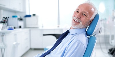 Smiling man in dentist’s chair