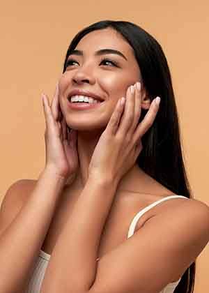 Woman smiling after facial cosmetic surgery