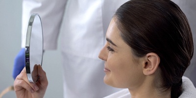 Woman in pain holding jaw