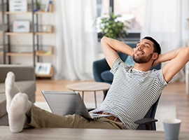 Man resting at home after dental implant placement procedure