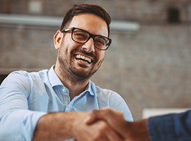 Man learning about the cost of dental implants in Carmichael