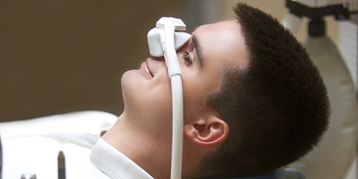 Male patient being sedated with nitrous oxide gas