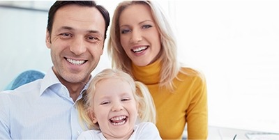 Mother father and child in dental office