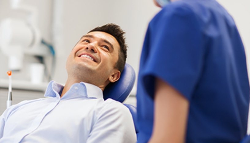 Smiling man in dental chair