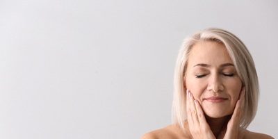 Woman enjoying relief after treatment with a TENS machine