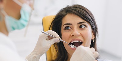Woman receiving dental treatment