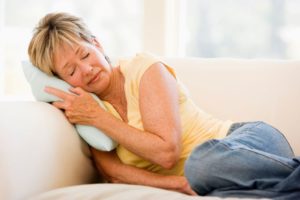 Woman relaxing at home on sofa