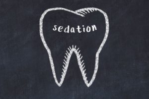 “Sedation” written on chalkboard inside tooth-shaped outline