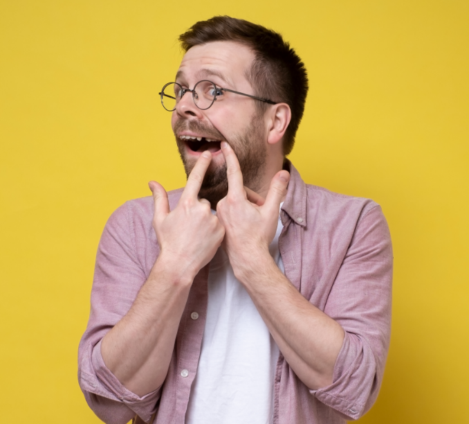 Man showing missing tooth
